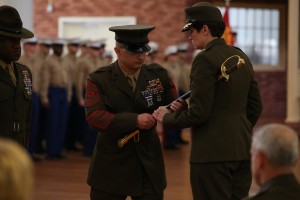 Sgt. Maj. Gary Buck turns in his sword of office to Brig. Gen. Lori Reynolds, Commanding General of Marine Corps Recruit Depot Parris Island, S.C., on Feb. 21, 2014, as part of a Sergeants Major Post and Relief ceremony for the Marine Corps Recruit Depot Parris Island and Eastern Recruiting Region. Sgt. Maj. Buck retired after 29 years of service to the Corps and was replaced by Sgt. Maj. Paul Archie.