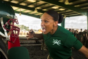Sgt. Trelaine S. Buffaloe, a martial arts instructor, motivates Rct. Keyla M. Sanchez, Platoon 4017, Papa Company, 4th Recruit Training Battalion, during a pugil stick match March 4, 2015, on Parris Island, S.C.  (Photo by Sgt. Jennifer Schubert)