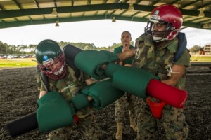 Rct. Tyequifa E. Elmore, Platoon 4016, Papa Company, 4th Recruit Training Battalion, lands a winning blow on her opponent during a pugil stick match March 4, 2015, on Parris Island, S.C. (Photo by Sgt. Jennifer Schubert)