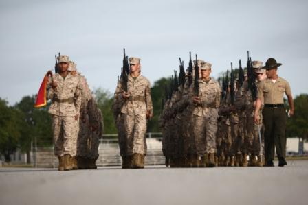 Senior drill instructor of Platoon 1042, Alpha Company, 1st Recruit Training Battalion, leads his platoon during their final drill evaluation