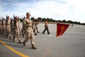 Staff Sgt. Victor Lucio, senior drill instructor of Platoon 1044, Alpha Company, 1st Recruit Training Battalion, and his recruits march past the drill masters during their final drill evaluation June 5, 2013, on Parris Island, S.C. (Photo by Lance Cpl. Mary Ann Hill)