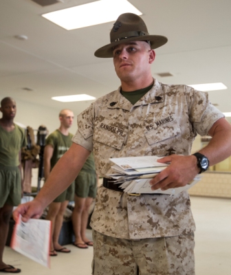 The senior drill instructor of Platoon 2080, Fox Company, 2nd Recruit Training Battalion, distributes mail to his recruits at the end of the training day. Mail is distributed at the end of each training day Monday through Saturday. (Photo by Cpl. David Bessey)