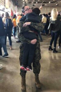 Pfc. Brooke Billiot is reunited with her son, Kysan, following a graduation ceremony at MCRD Parris Island. In order to become a Marine, Billiot was required to relinquish custody of her son, due to the inability of recruits to care for their dependents while completing the 13-week training cycle. (U.S. Marine Corps photo by Sgt. Shellie Hall)