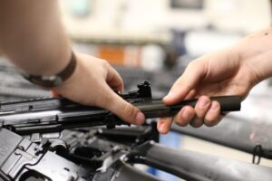 A Marine disassembles a rifle in order to clean it. (U.S. Marine Corps photo by Lance Cpl. Ryan Hageali)