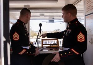 Staff Sgt. Christopher Davis and Staff Sgt. Mark Gulotta, with the Recruit Training Regiment, discuss vocal techniques on Marine Corps Recruit Depot Parris Island, S.C., Feb 25, 2022. (U.S. Marine Corps photo by Lance Cpl. Michelle Brudnicki)
