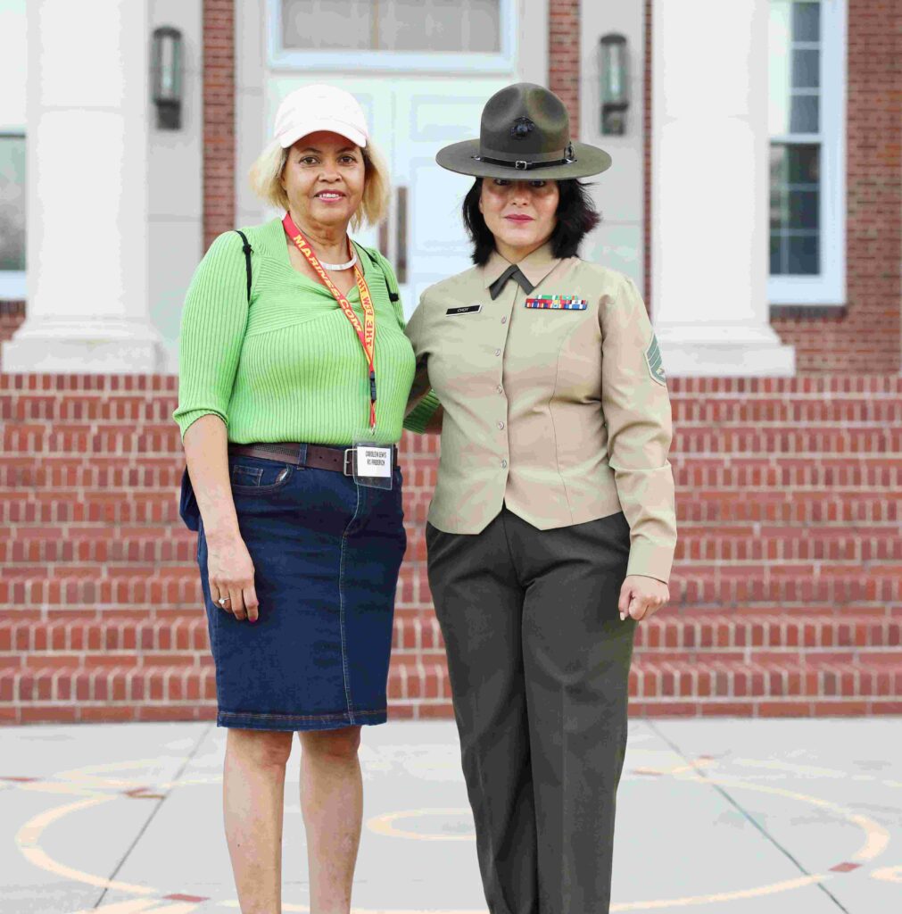 Mrs. Caroline Lewis, left, a teacher at Westmoreland high school, and U.S. Marine Corps Staff Sergeant Choy, a drill instructor at MCRD PI. (U.S. Marine Corps photo by Sgt. Ryan Sammet)