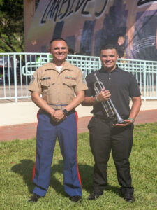 U.S. Marine Corps Staff Sgt. Carlos Ortiz, the music technical assistant for 6th Marine Corps District, and Evan Nazario, a Music Enlistment Option Program candidate. (U.S. Marine Corps photo by Lance Cpl. Kevin Lopez Herrera)